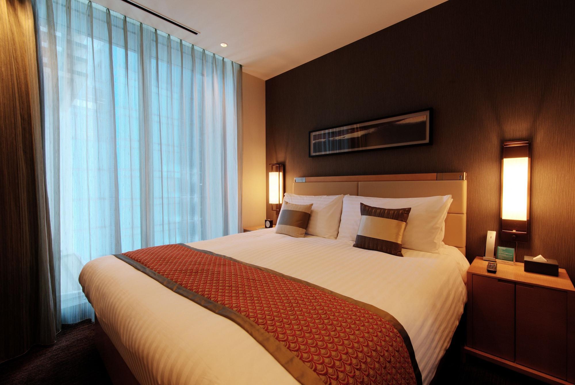 Oakwood Premier Tokyo Hotel Екстериор снимка A bedroom in a hotel